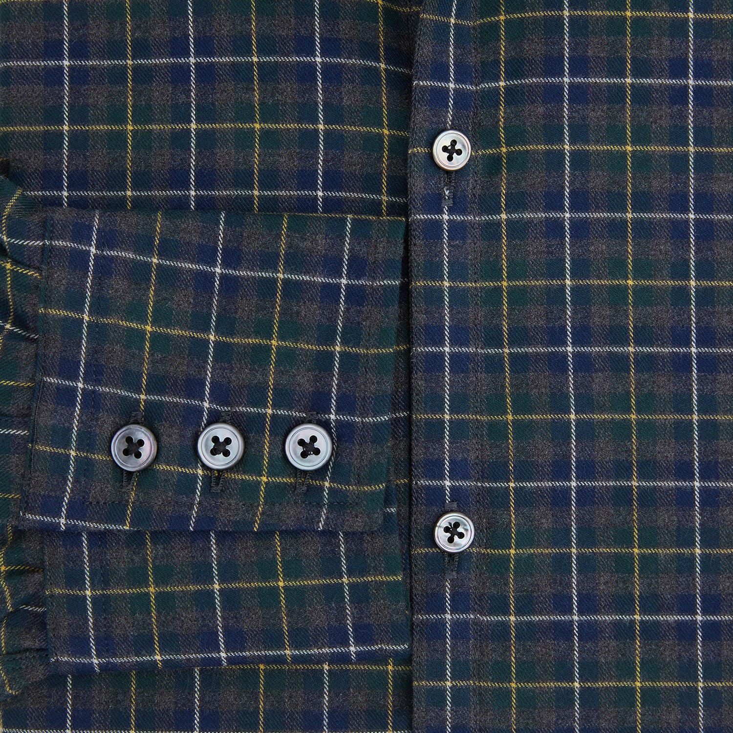 View 4 of product The Turnbull & Asser Navy and Khaki Tartan Windsor Shirt features a long-sleeve button-up design with a Windsor collar and buttoned cuffs, showcasing British craftsmanship in a classic tartan pattern.