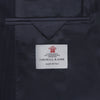 View 4 of product The Turnbull & Asser Navy Wool Pinstripe Double-Breasted Jacket features peak lapels, four front buttons, and three front pockets, and is displayed on a plain white background.