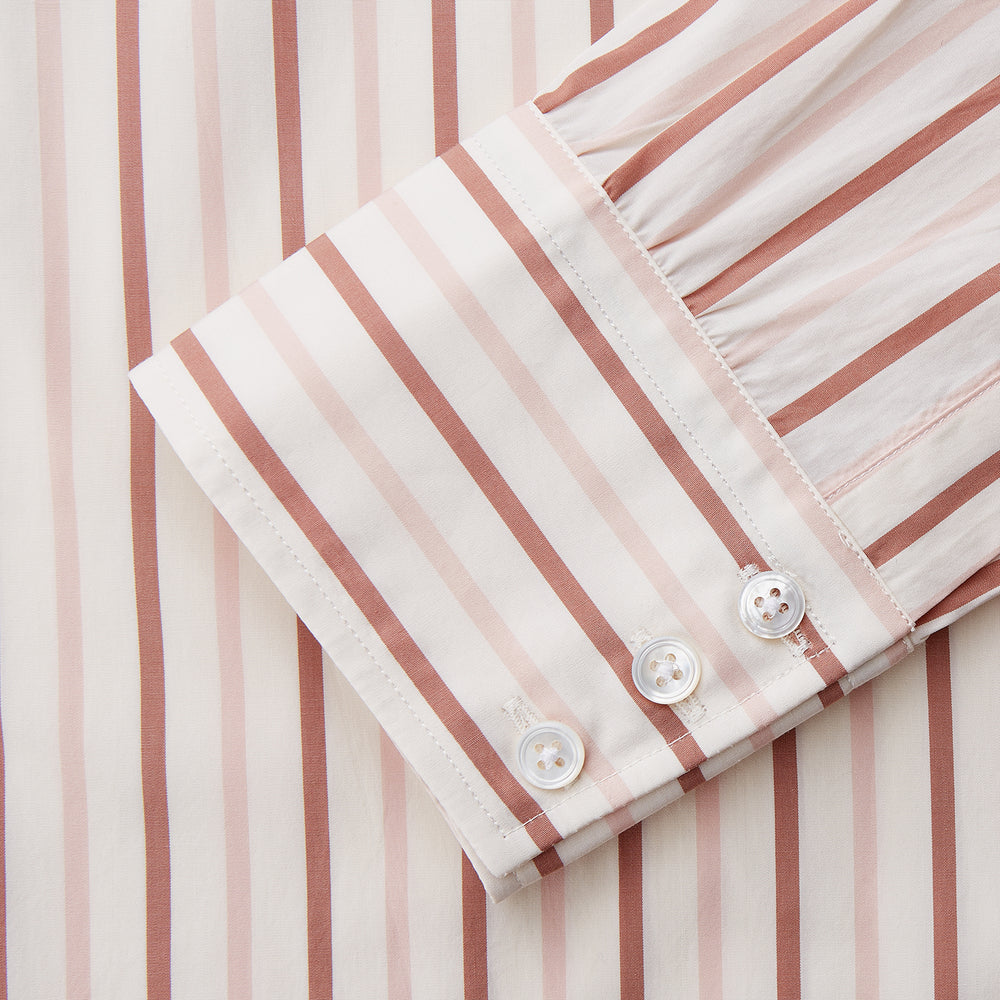 The Pink and Sandstone Stripe Cotton Regular Fit Mayfair Shirt by Turnbull & Asser features vertical pink and sandstone stripes on white, a T&A collar, wide cuffs, and a slightly curved hem for refined detail.