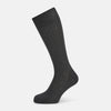 View 1 of product A single Concrete Mid-Length Sock by Turnbull & Asser, crafted from mercerised Egyptian cotton for refined comfort, is shown upright on a white background with the toe pointing left and the cuff at the top.