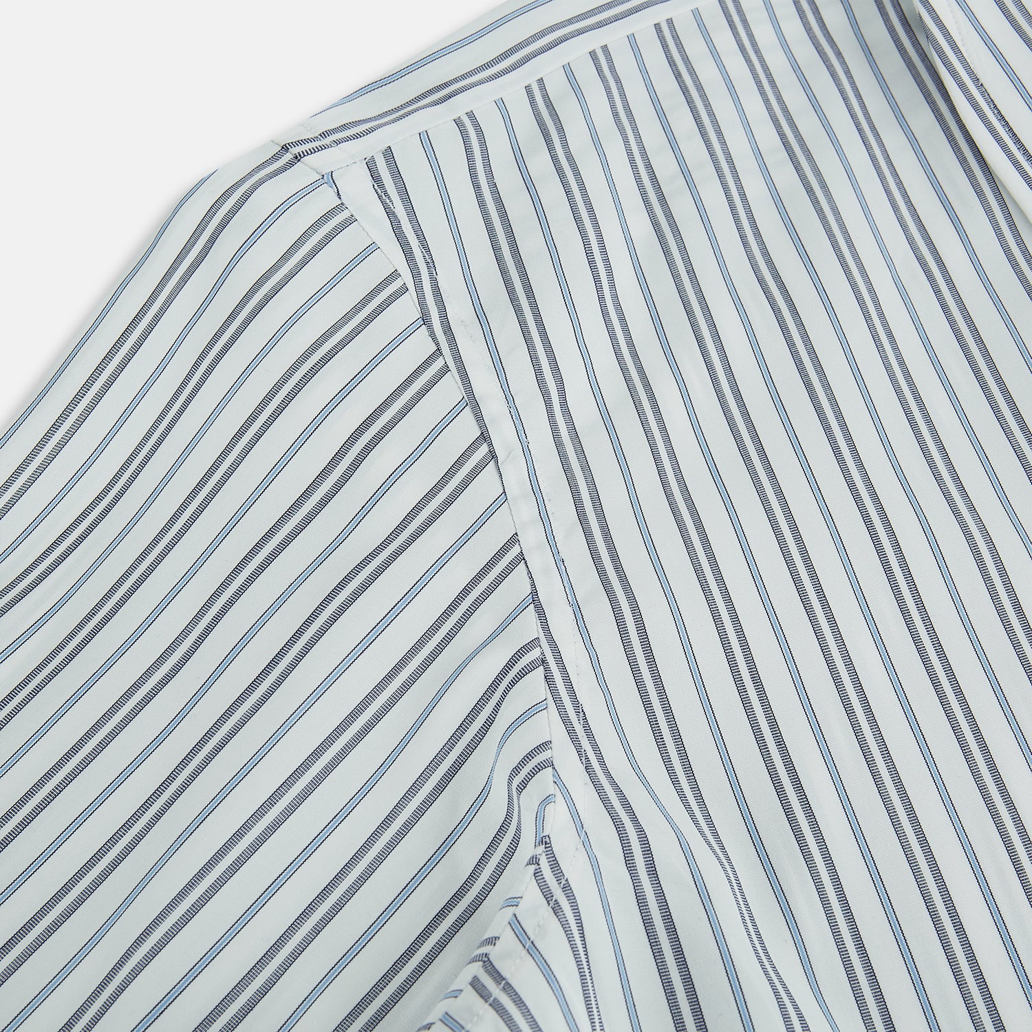 View 6 of product The Turnbull & Asser Navy and Light Blue Multi Track Stripe Westminster Shirt, featuring a button-up design with long sleeves and a signature collar, is displayed flat to highlight its expert British craftsmanship.