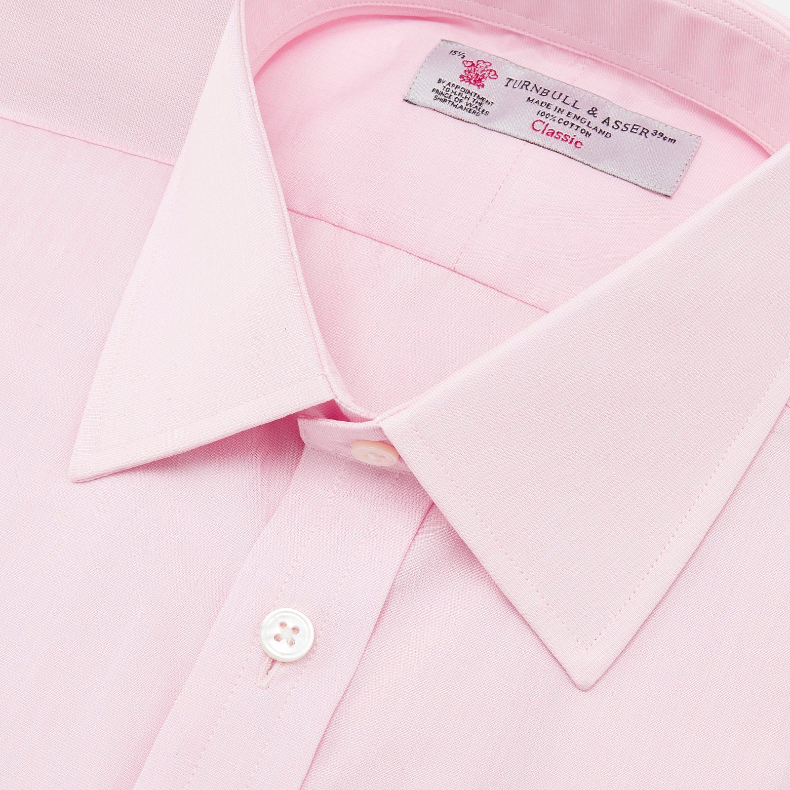View 5 of product The Pink End-on-End Shirt with T&A Collar and Double Cuffs by Turnbull & Asser, shown neatly folded on a white background, updates timeless elegance with its classic detailing and refined pink hue.