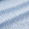 View 4 of product The Turnbull & Asser Blue and Green Stripe Poplin Cotton Nightshirt features long sleeves, a rounded hem, front pocket, green-trimmed collar and pocket, and front buttons—ideal men's nightwear for any season.