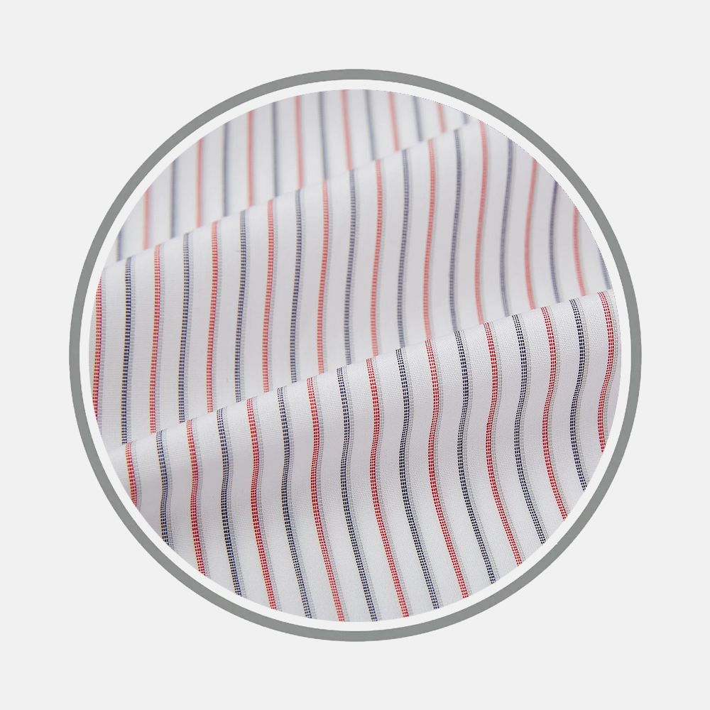 Close-up of Turnbull & Asser’s Red and Blue Double Stripe Fabric, featuring evenly spaced vertical red and blue stripes on white, displayed in a circular frame against a light gray background.