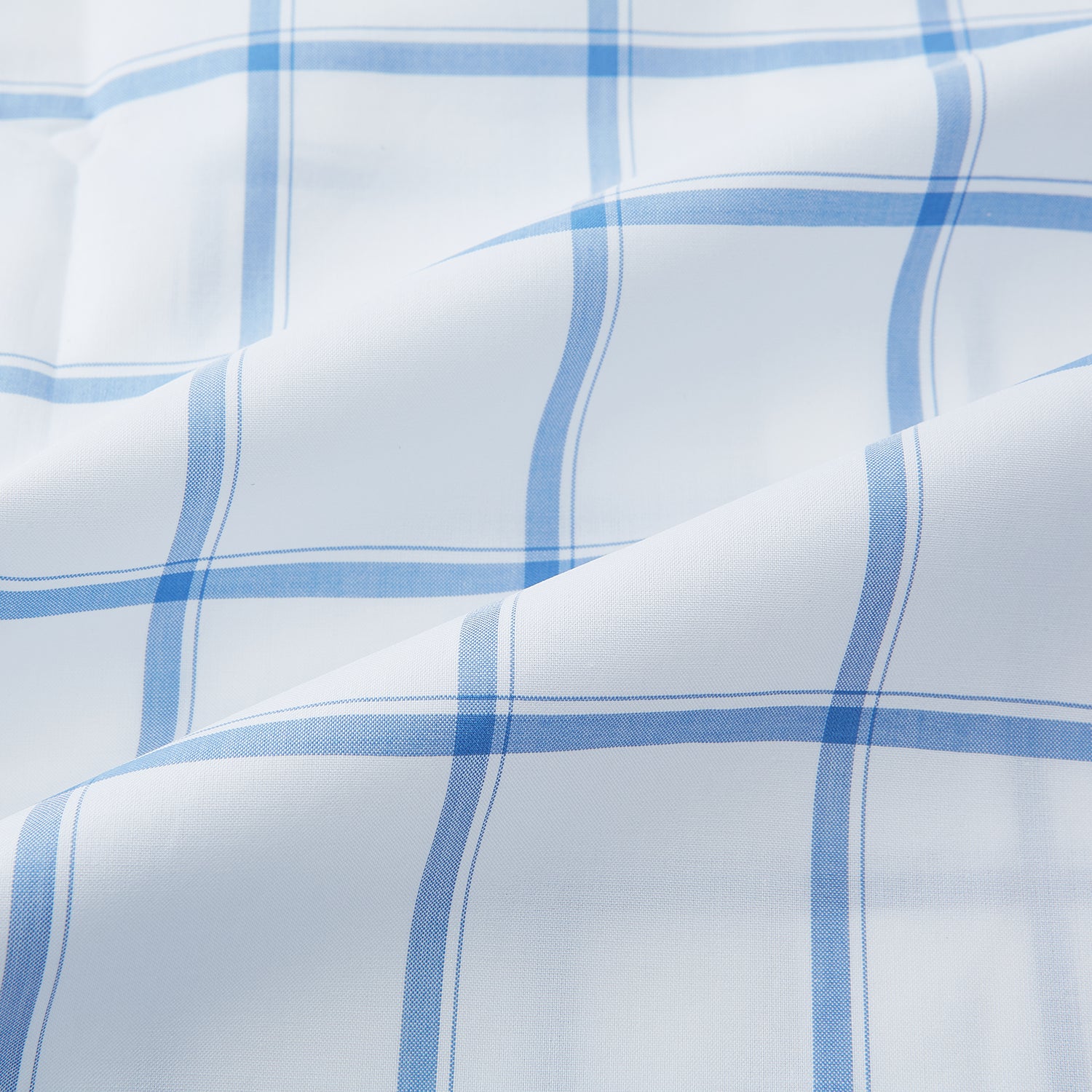 View 6 of product The Turnbull & Asser Colony Blue Grid Check Mayfair Shirt features long sleeves, a button-down front, Italian cotton fabric, a spread collar, and buttoned cuffs, shown against a plain white background.