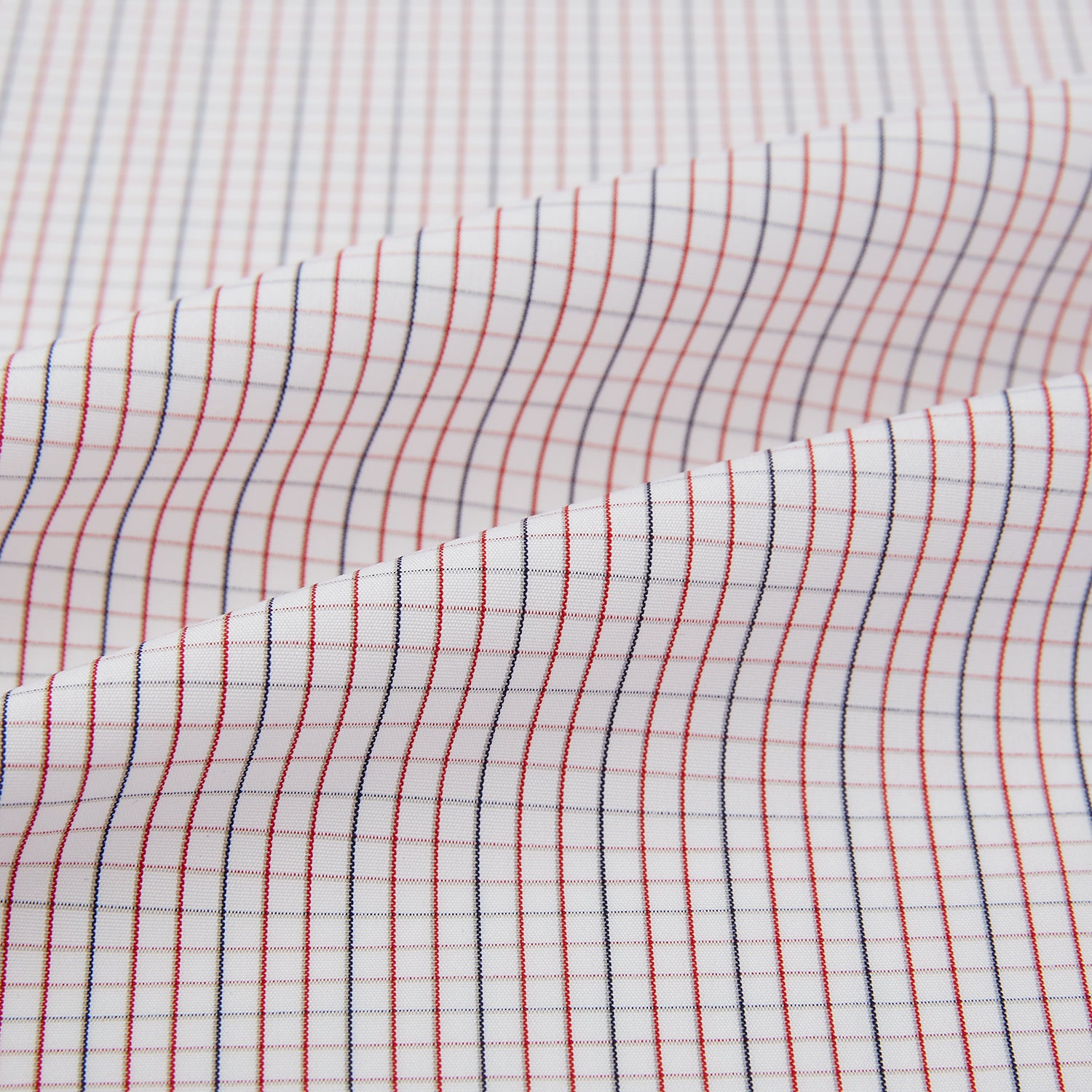 View 8 of product The Turnbull & Asser Red and Navy Check Windsor Shirt features a pointed collar and cuffed long sleeves, highlighting British craftsmanship. Displayed flat on a white background.