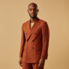 View 2 of product The Turnbull & Asser Rust Linen-Wool-Silk Bertie Blazer is a red double-breasted jacket with peak lapels, black buttons, and flap pockets, tailored in Italy from a luxury linen-wool-silk blend and shown on a white background.