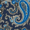 View 3 of product The Turnbull & Asser Blue and Navy Twisted Paisley Silk Tie displays intricate blue, white, and black details, rolled up against a plain white background.