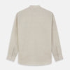 View 5 of product The Turnbull & Asser Light Oatmeal Linen Weekend Fit Unwin Shirt features long sleeves, a band collar, and two chest pockets—an ideal choice for effortless summer style.