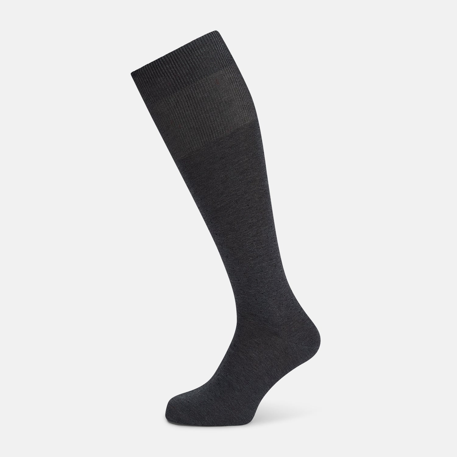 View 1 of product The Turnbull & Asser Steel/midnight Polka Dot Long Sock is shown in dark gray over the calf, displayed from the side on a white background with downward toe and ribbed top for a snug fit.