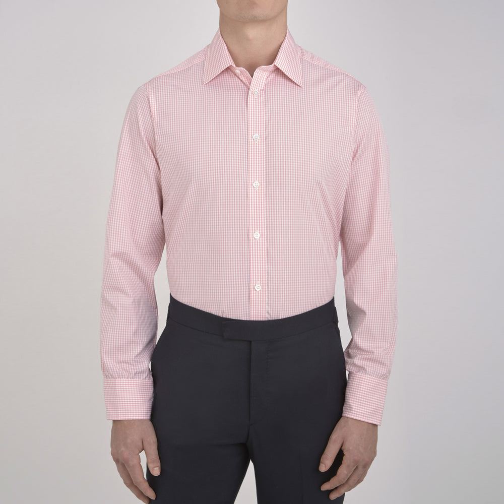 The Turnbull & Asser Light Pink Gingham Check Shirt features a classic T&A collar, 3-button cuffs, and white buttons, neatly folded on a plain white background.