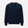 View 1 of product The Turnbull & Asser Navy Cashmere Round Neck Jumper for men is shown against a white background, featuring long sleeves, a relaxed fit, and ribbed cuffs, hem, and collar for an effortlessly elegant look.