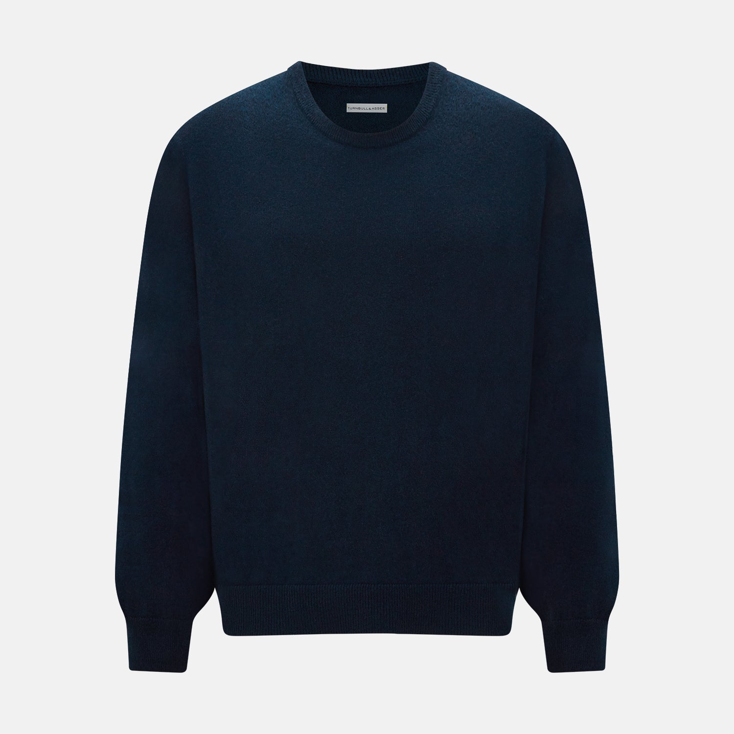 View 1 of product The Turnbull & Asser Navy Cashmere Round Neck Jumper for men is shown against a white background, featuring long sleeves, a relaxed fit, and ribbed cuffs, hem, and collar for an effortlessly elegant look.