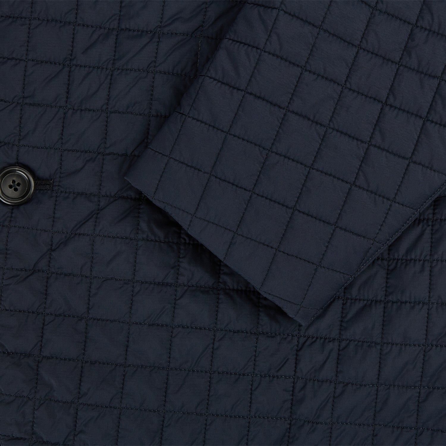 View 4 of product The Fulham Navy Single-Breasted Quilted Blazer by Turnbull & Asser features a notched lapel, three black buttons, a chest pocket, and two front flap pockets. Shown on a plain white background—ideal for the modern gentleman.