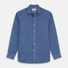 View 1 of product The Blue Weekend Fit Linen Finch Shirt by Turnbull & Asser features a Derby collar, chest pocket, and white buttons. Made from mid-blue linen chambray, it offers effortless casual style when laid flat on a plain white background.