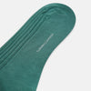 View 3 of product The Sage Long Sock by Turnbull & Asser is a knee-high, ribbed green sock made from premium Egyptian cotton, displayed against a plain white background.