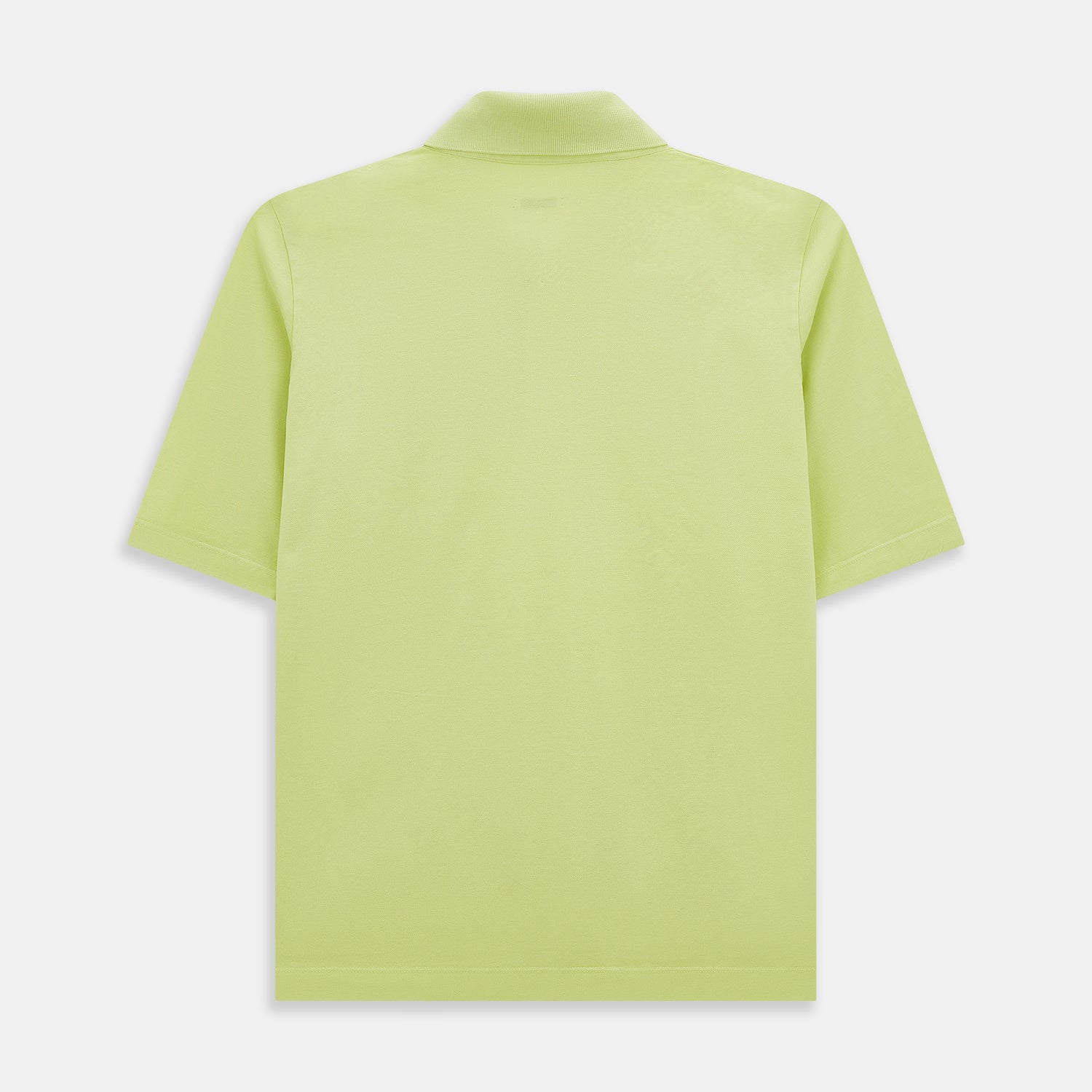 View 3 of product The Turnbull & Asser Lime Green Polo Shirt features a cotton jersey build, short sleeves, a collar, three brown buttons on the placket, and a chest pocket with a button. Shirt shown laid flat on a white background.