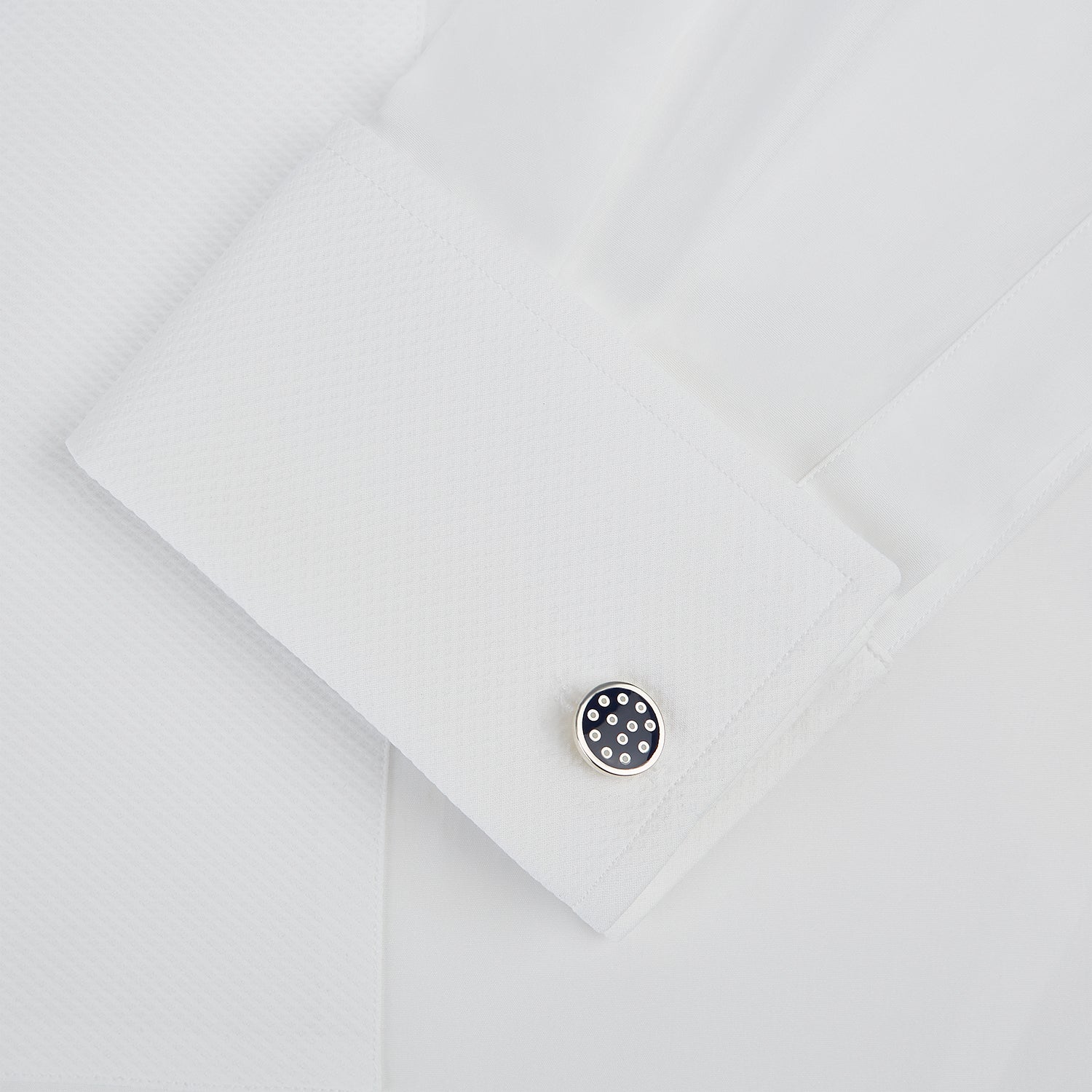 View 3 of product The Turnbull & Asser Navy Spotted Circle Enamel Cufflinks feature round faces with silver polka dots, offering a classic men's accessory in a striking navy design.