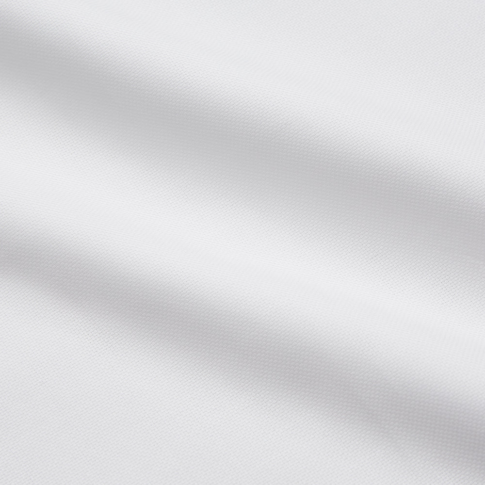 The Turnbull & Asser White Cotton Voile Regular Fit Mayfair Shirt features long sleeves, a pointed collar, button-down front, and buttoned cuffs, displayed flat against a plain white background.