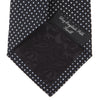 View 4 of product The Turnbull & Asser Black and White Spot Printed Silk Tie, shown neatly rolled on a plain white background, is an essential accessory to elevate any smart attire.