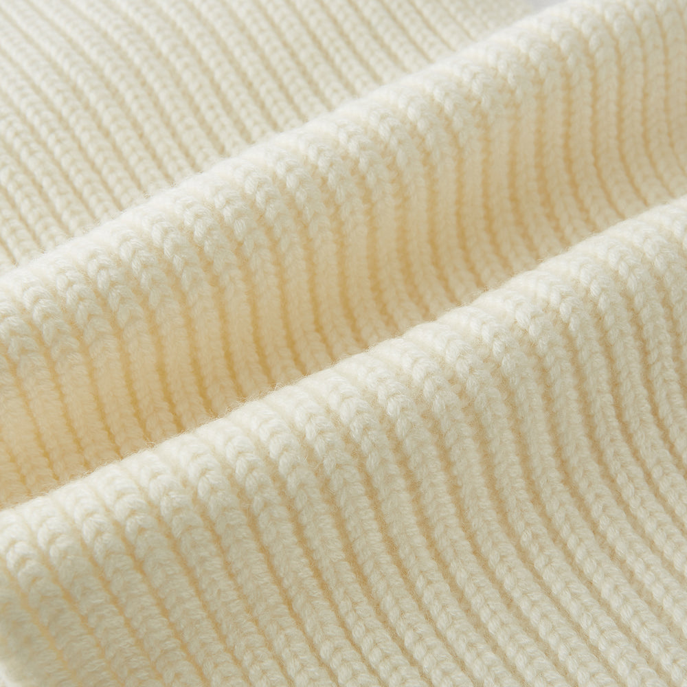 The Turnbull & Asser Ivory Rib-Knit Cashmere Scarf is tied in a simple loop, showing off its textured finish against a plain white background.