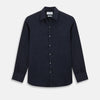 View 1 of product The Navy Linen Windsor Shirt by Turnbull & Asser features long sleeves, white buttons, a Turnbull collar, and buttoned cuffs in dark navy blue linen. Shown laid flat on a white background.