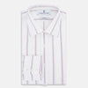 View 5 of product The Turnbull & Asser Antique Pink Track Stripe Mayfair Shirt is a white, long-sleeved Italian cotton shirt with vertical pink stripes, a spread collar, and buttoned cuffs, shown laid flat on a white background.