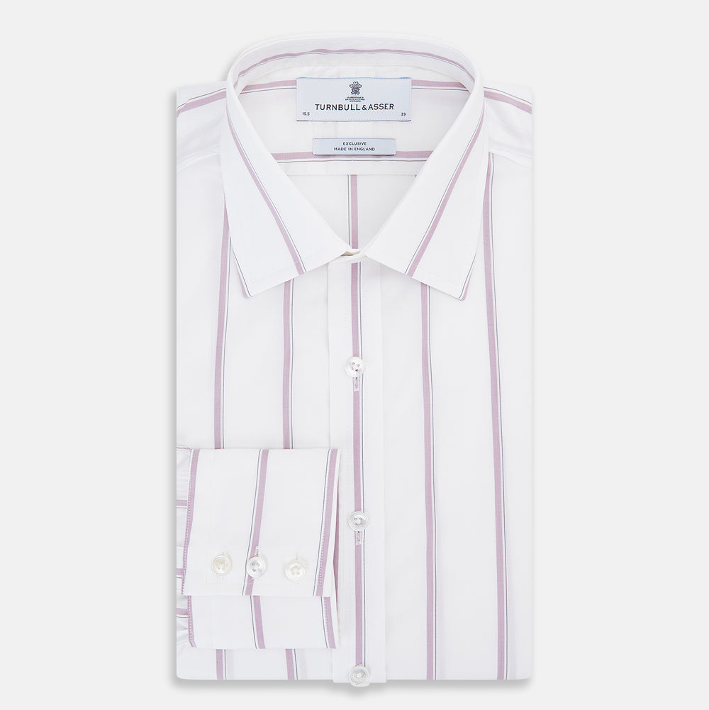 The Turnbull & Asser Antique Pink Track Stripe Mayfair Shirt is a white, long-sleeved Italian cotton shirt with vertical pink stripes, a spread collar, and buttoned cuffs, shown laid flat on a white background.