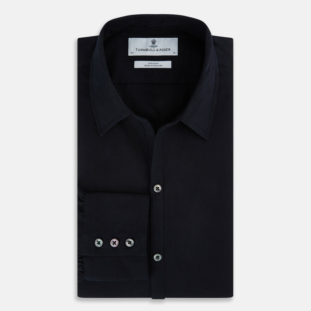 The DARK NAVY WINDSOR SHIRT by Turnbull & Asser is a long-sleeve shirt with a refined Windsor collar, showcasing classic British craftsmanship.