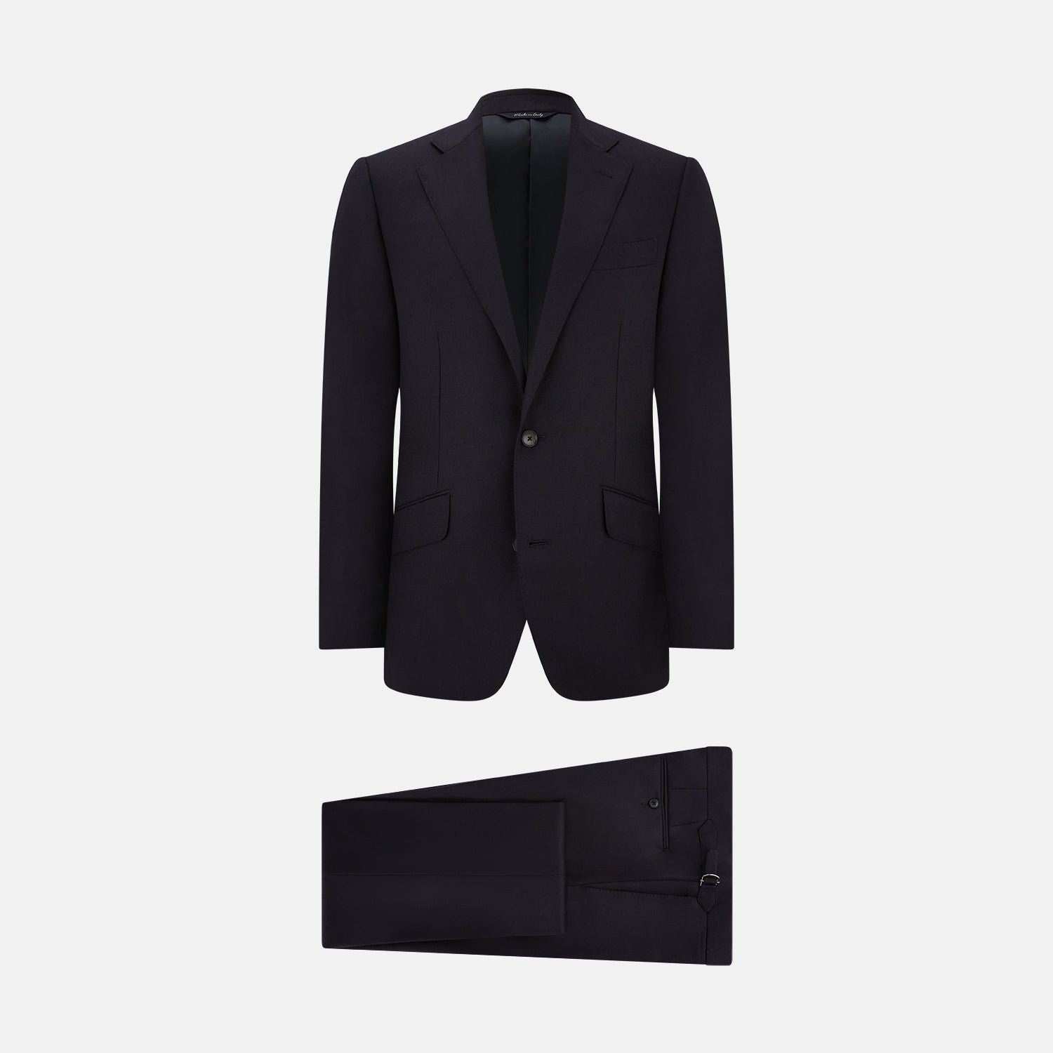 View 1 of product The Turnbull & Asser Short Navy Single Breasted Suit is shown flat on a white background, with a notch lapel jacket featuring two front pockets and matching trousers neatly folded underneath.