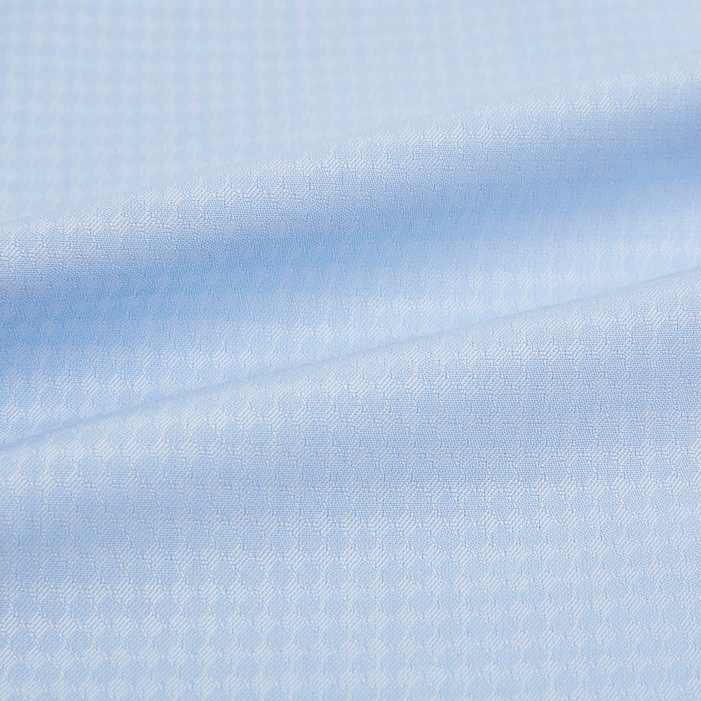 The Pale Blue Rhombus Mayfair Shirt by Turnbull & Asser features long sleeves, a classic collar, white buttons, and buttoned cuffs, shown laid flat on a white background.