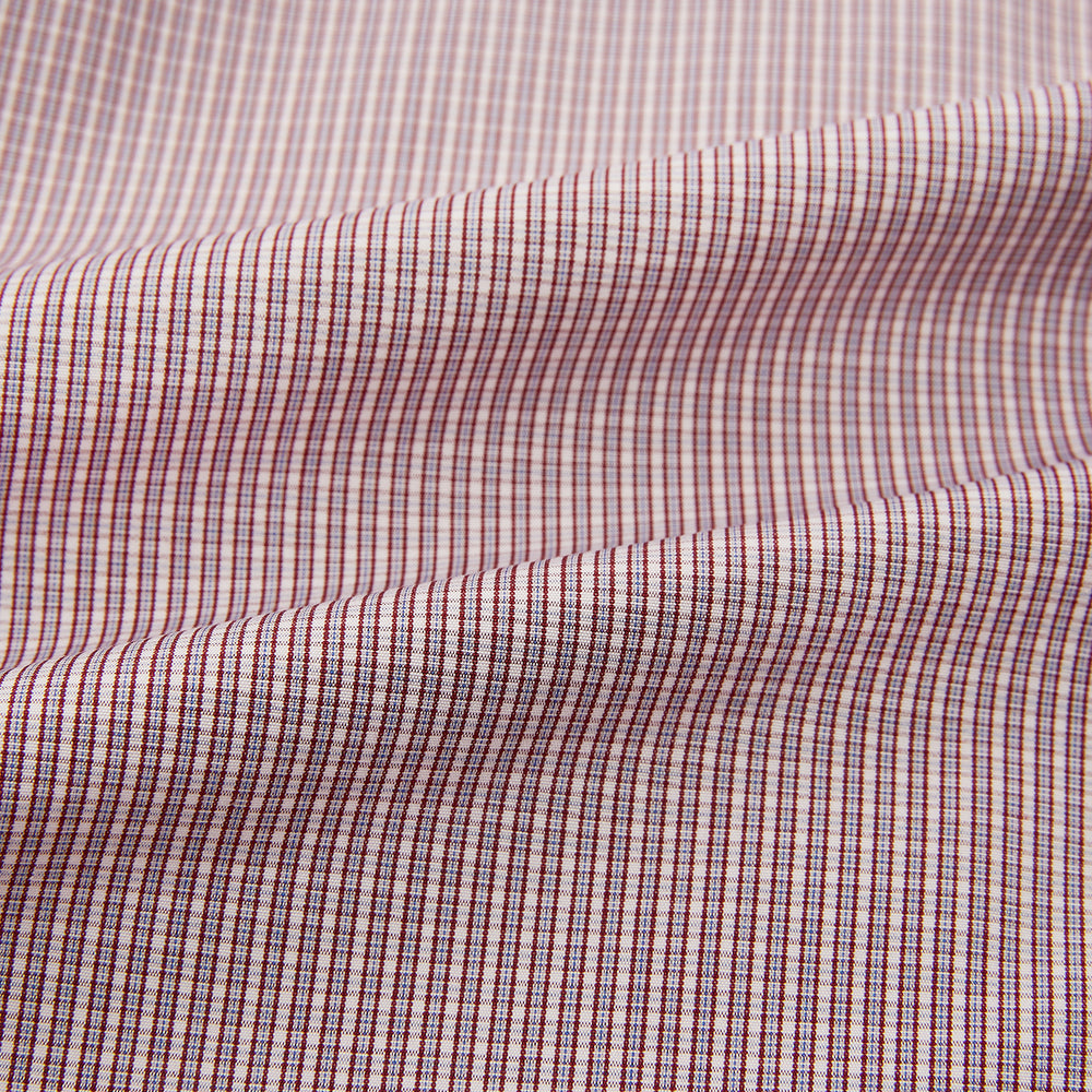 The Turnbull & Asser Burgundy Micro Shadow Check Mayfair Shirt features long sleeves, a classic collar, and white buttons. In light red and white shades, this button-up is perfect for formal wear and is shown laid flat against a white background.