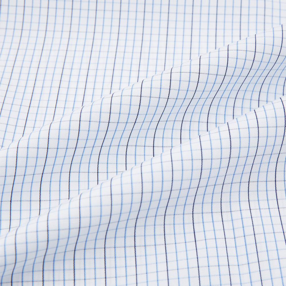 The Turnbull & Asser Pale Blue and Navy Grid Check Shirt features a contrast T&A collar and cuffs, long sleeves, and a button-down front, all displayed on a plain white background.