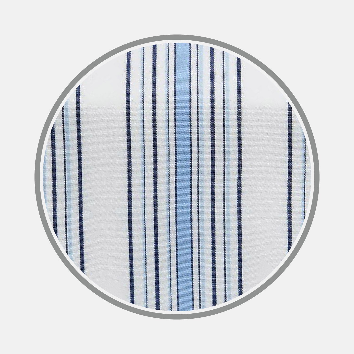 View 1 of product A close-up of Turnbull & Asser's Blue Multi Stripe Cotton Fabric shows white material with vertical light and dark blue stripes in varying widths, displayed inside a circular frame.