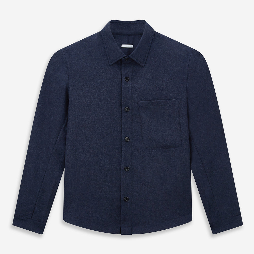 The Turnbull & Asser Mid Blue Highbury Overshirt features long sleeves, a button-up front, collar, and single chest pocket, shown laid flat on a white background.