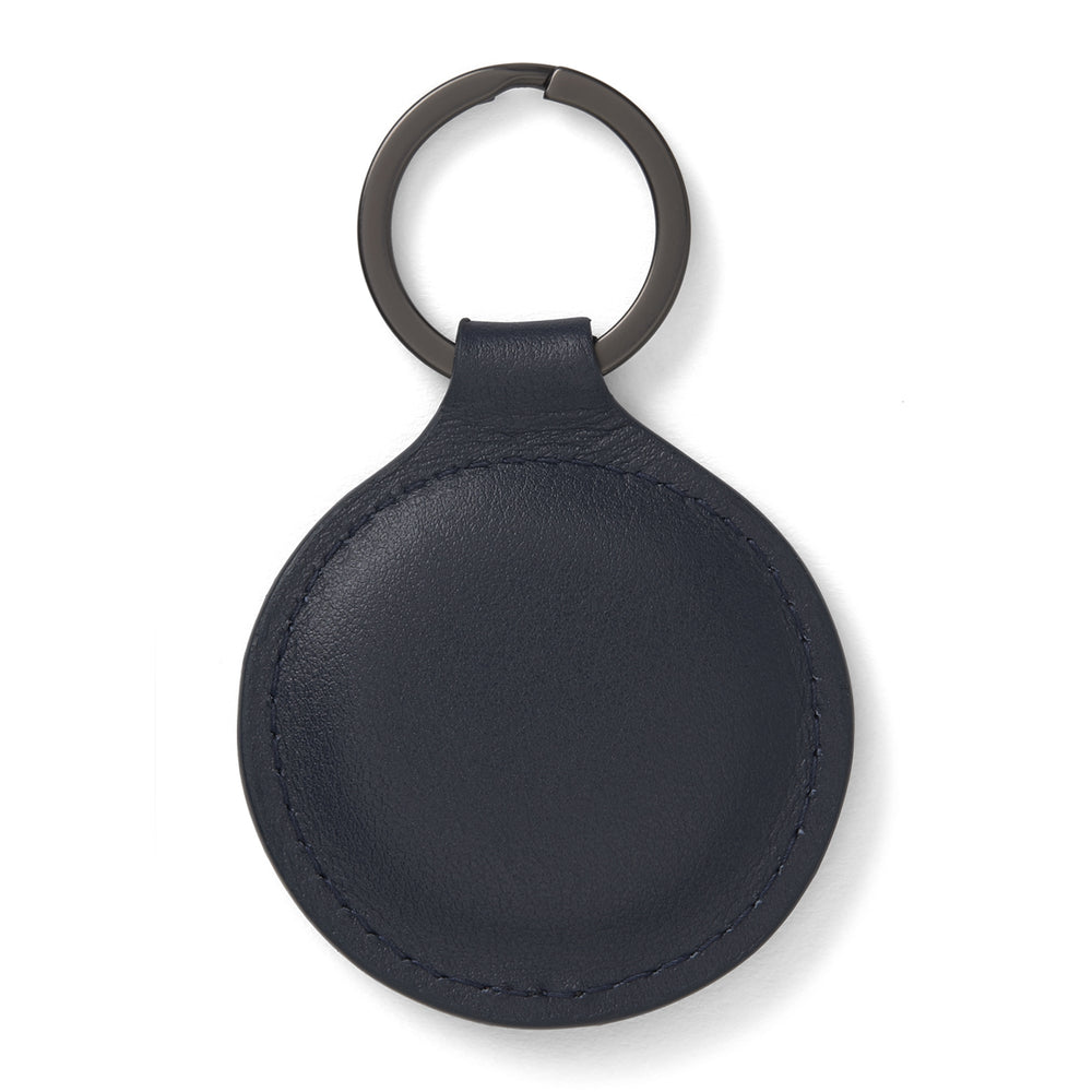 The Dark Navy Leather Fob Holder by Turnbull & Asser features round, dark blue leather with subtle embossed branding and a metallic key ring.