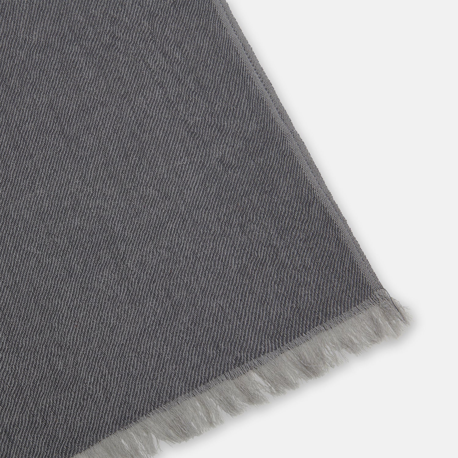 View 2 of product The Turnbull & Asser Grey and Beige Cashmere Scarf features beige, tan, gray, and charcoal color blocks in a rectangular shape with fringed edges at both ends, elegantly displayed against a plain white background.