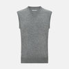 View 1 of product Turnbull & Asser's Grey Melange V-neck Cashmere Vest features classic ribbed trim at the neck, armholes, and hem—an elegant addition to any gentleman’s wardrobe, shown here against a plain white background.