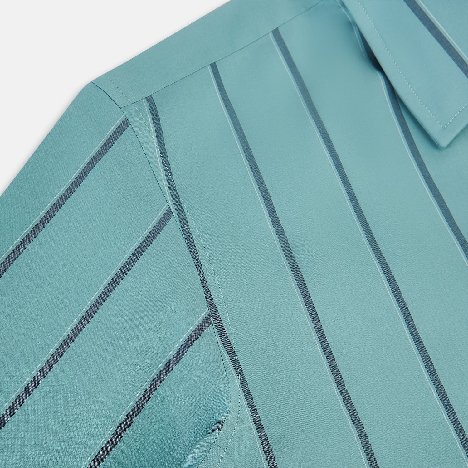 View 6 of product The Turnbull & Asser Sage Track Stripe Westminster Shirt features long sleeves, a tailored fit, a collar, and vertical dark blue stripes, with button closures down the front and at the cuffs, shown laid flat on a white background.