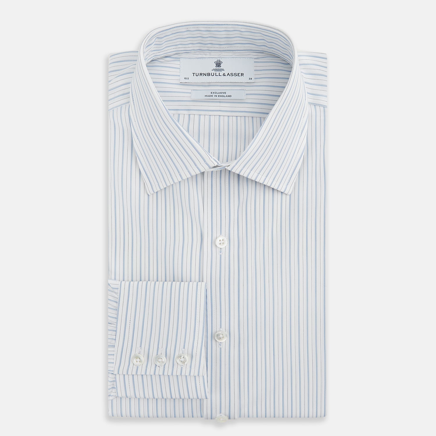 View 5 of product The Turnbull & Asser Sky Blue Combination Stripe Mayfair Shirt features long sleeves, a T&A collar, buttoned cuffs, and thin vertical stripes in blue, shown on a plain white background.