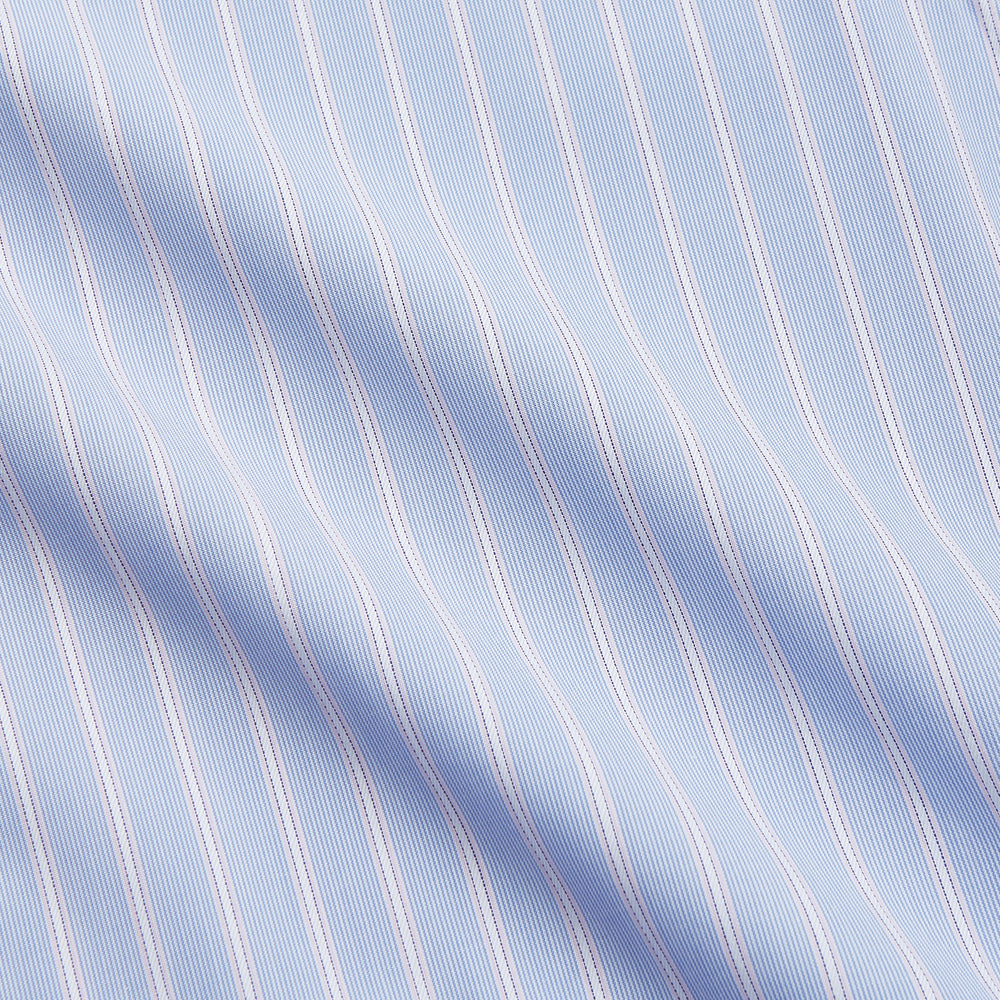 The Turnbull & Asser Blue Multi Stripe Cotton Regular Fit Whitby Shirt features white vertical stripes, long sleeves, button-down front, pointed collar, and buttoned cuffs, shown laid flat on a white background.