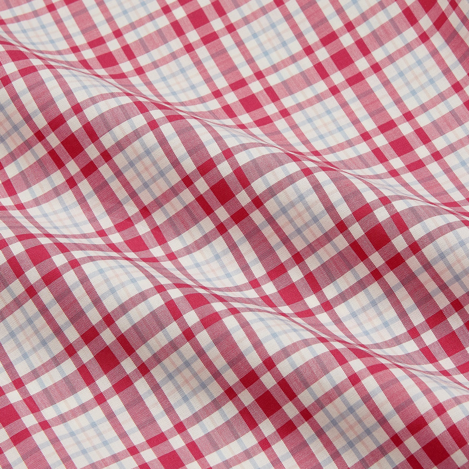 View 5 of product The Turnbull & Asser Red Check Cotton Weekend Fit Finch Shirt is a men's long-sleeved, button-up shirt with a Derby collar and red-and-white plaid pattern, displayed flat on a white background.