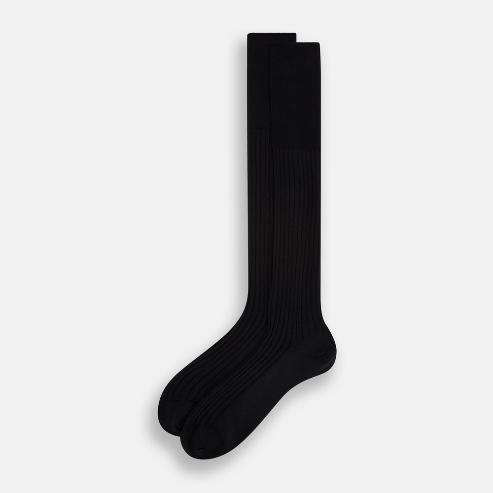 The Turnbull & Asser Black Wool Long Sock stands upright on a white background, featuring a ribbed texture with a fitted foot and calf, ideal for those seeking stylish over the calf socks.