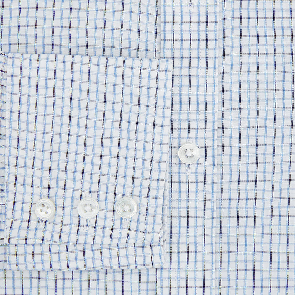 The Turnbull & Asser Navy and Blue Multi Check Mayfair Shirt features a T&A collar, button cuffs, and a blue checkered pattern. This long-sleeve, button-up shirt is shown on a white background.