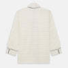 View 6 of product The Cream Pattern Cotton Blend Quin Pyjama Set by Turnbull & Asser features cream stripes, a long-sleeve button-up camp collar shirt with a chest pocket and black piping, and matching drawstring pants.