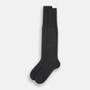 View 2 of product A single Charcoal/Brown Dash Striped Long Sock by Turnbull & Asser, made from mercerised Egyptian cotton, stands upright on a plain light background, showcasing its ribbed texture and fitted design.