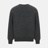 View 3 of product The Turnbull & Asser Charcoal Grey Cashmere Round Neck Jumper features a crew neck, long sleeves, and ribbed cuffs, collar, and hem—an essential piece of men’s knitwear displayed on a white background.