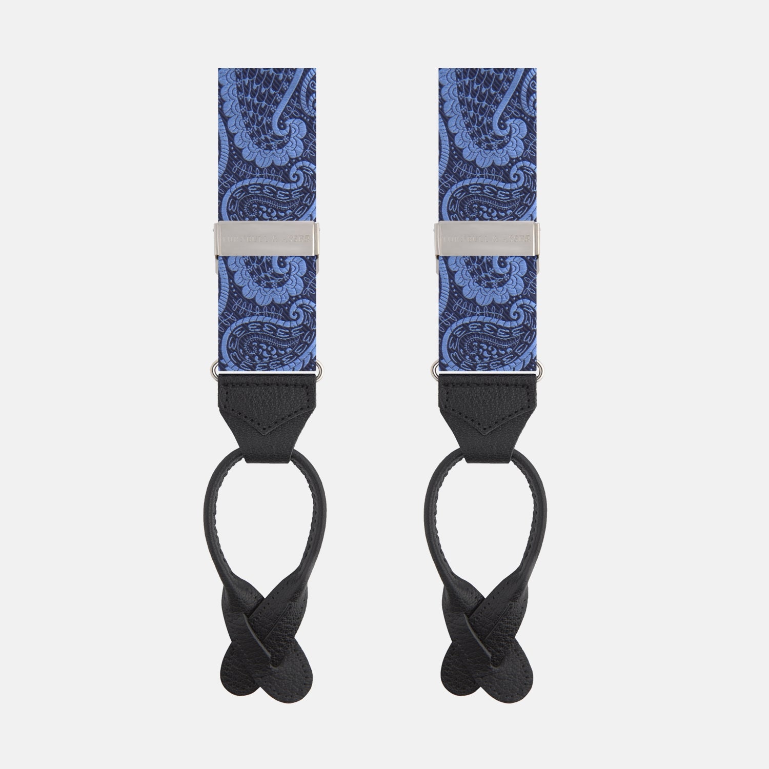 View 1 of product Two Jacquard Silk Paisley Braces by Turnbull & Asser, featuring a blue paisley pattern with black leather ends and silver hardware, displayed side by side on a white background.
