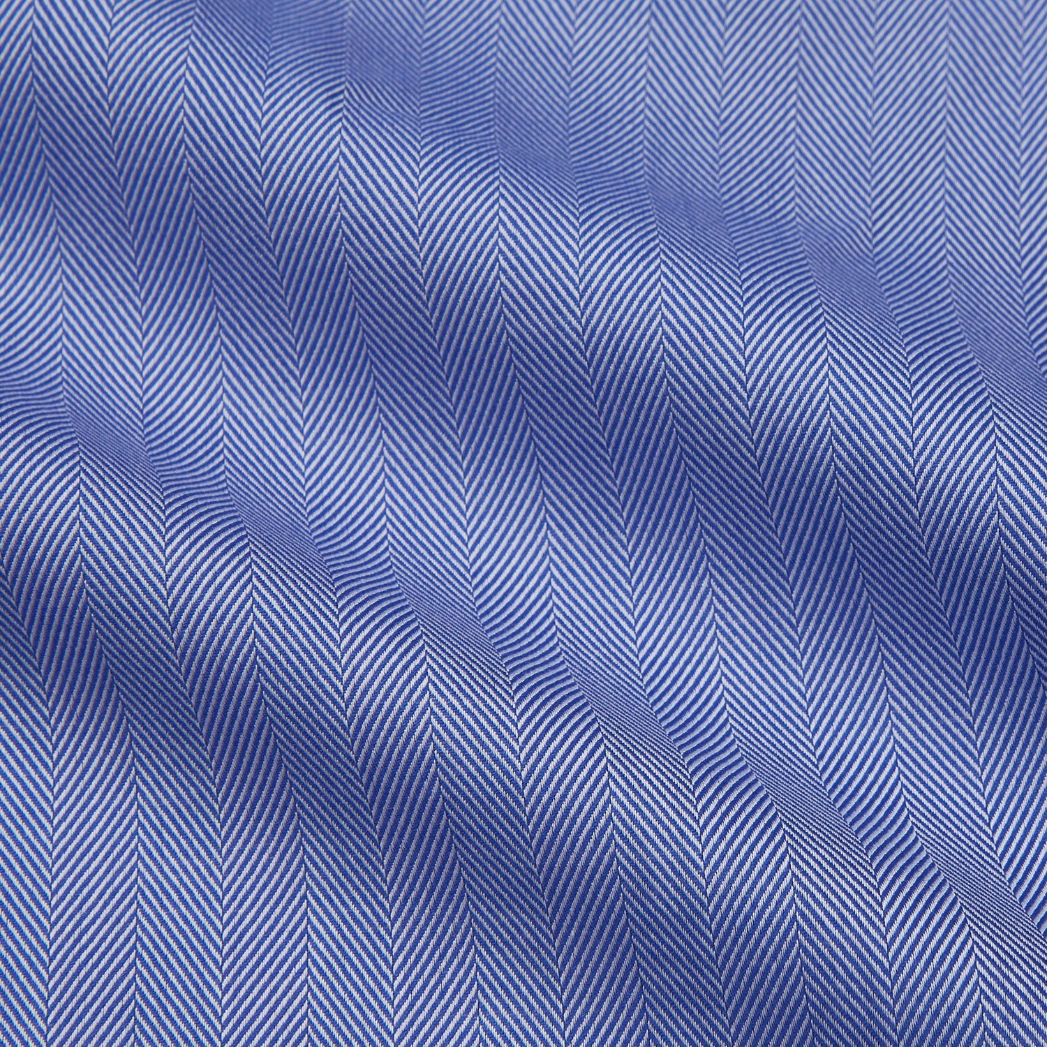 View 2 of product Turnbull & Asser's Blue Herringbone Tailored Fit Shirt with a Kent collar and white buttons is shown laid flat on a white background.