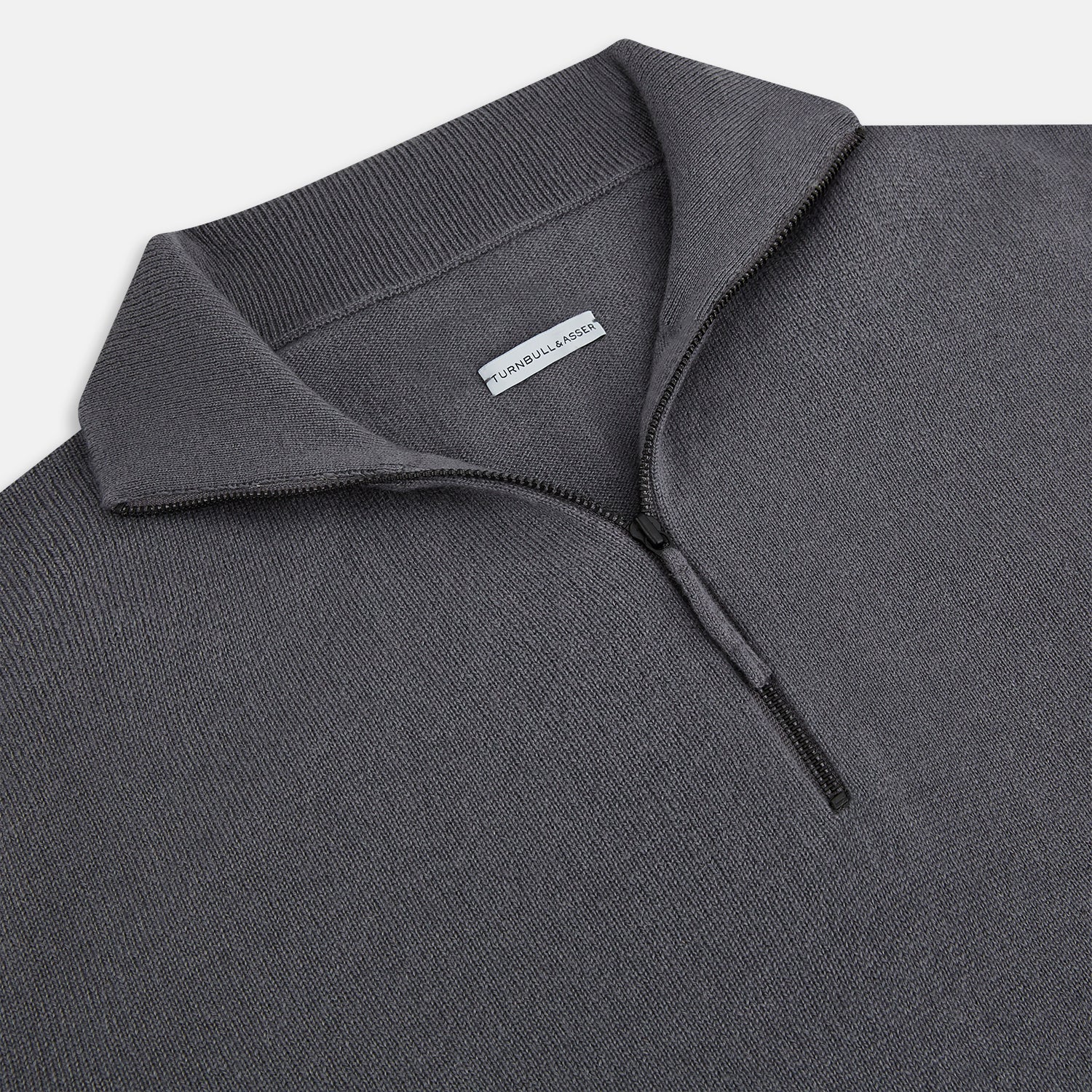 View 2 of product The Turnbull & Asser Grey Half-Zip Cashmere Jumper features long sleeves, a high collar, and premium yarn in dark gray. This classic knitwear is showcased against a white background.